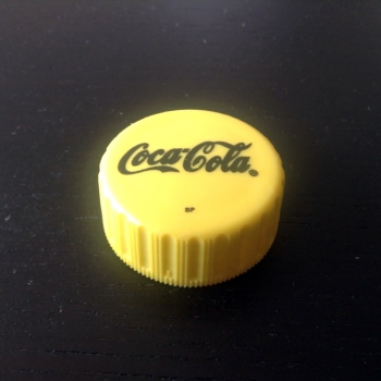 Coke Botle Cap from Zambia, in Yellow.